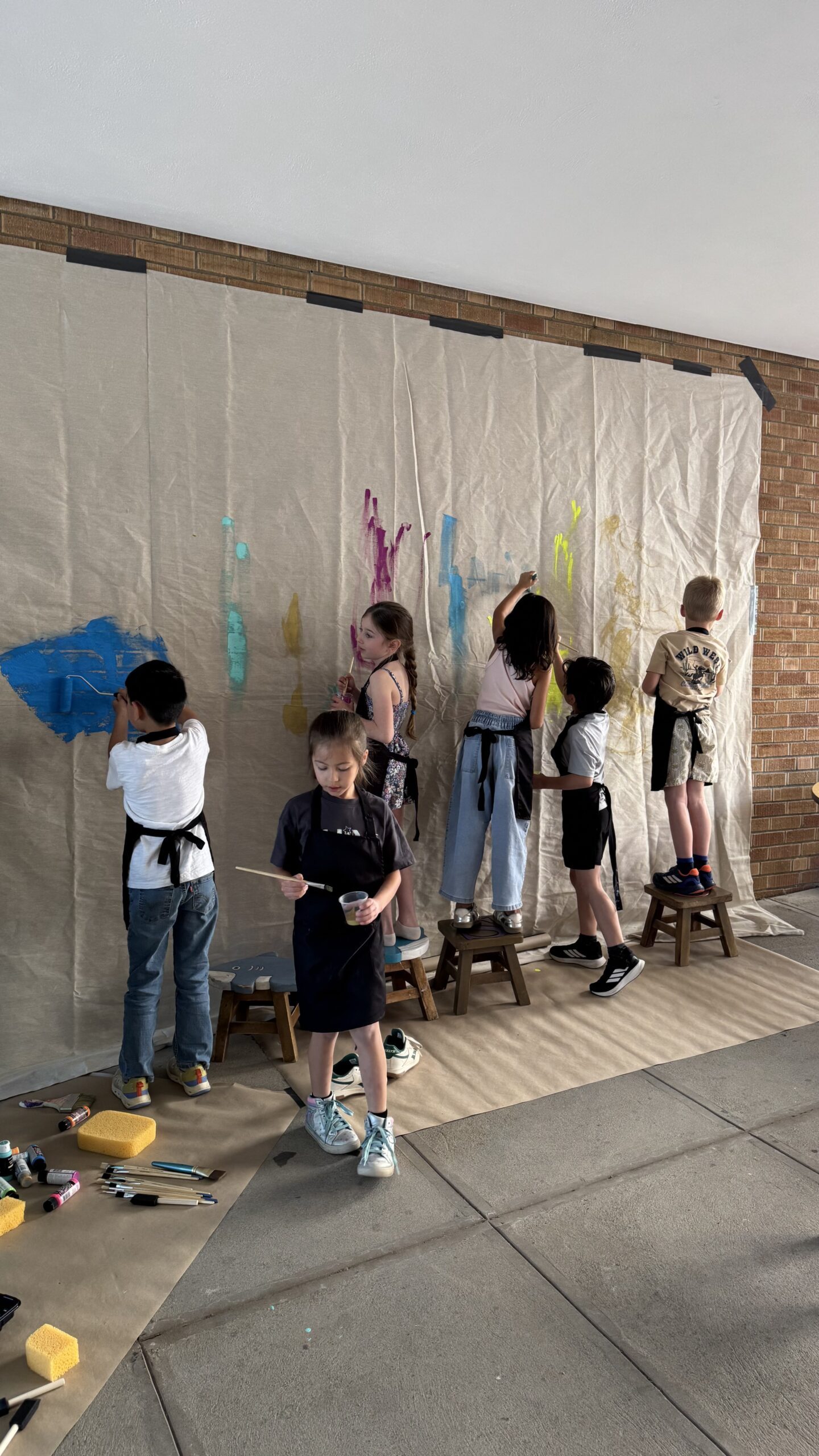 Children participating in a performing arts activity on a stage