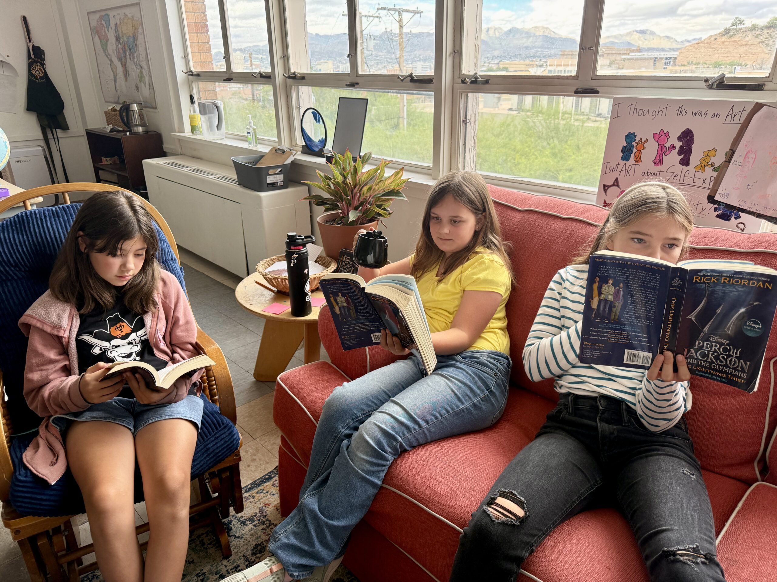 Willows students reading together on the classroom couch