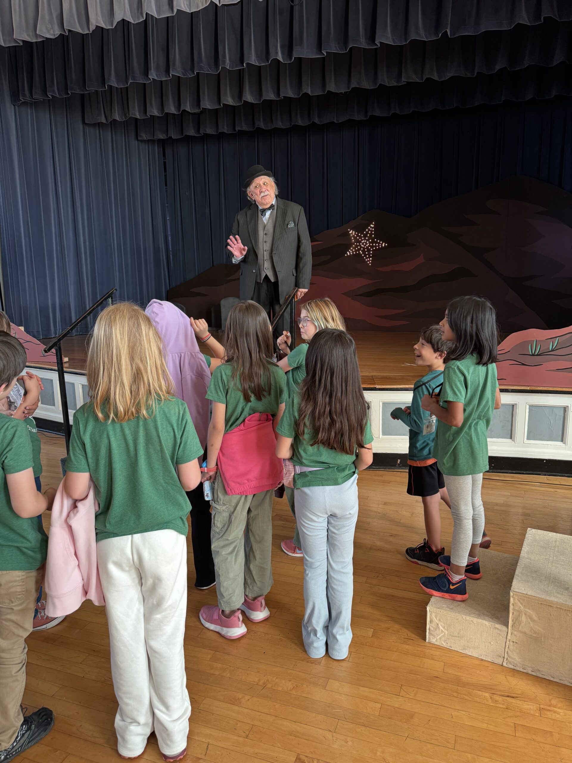 Students and their teacher gathered for a theater activity
